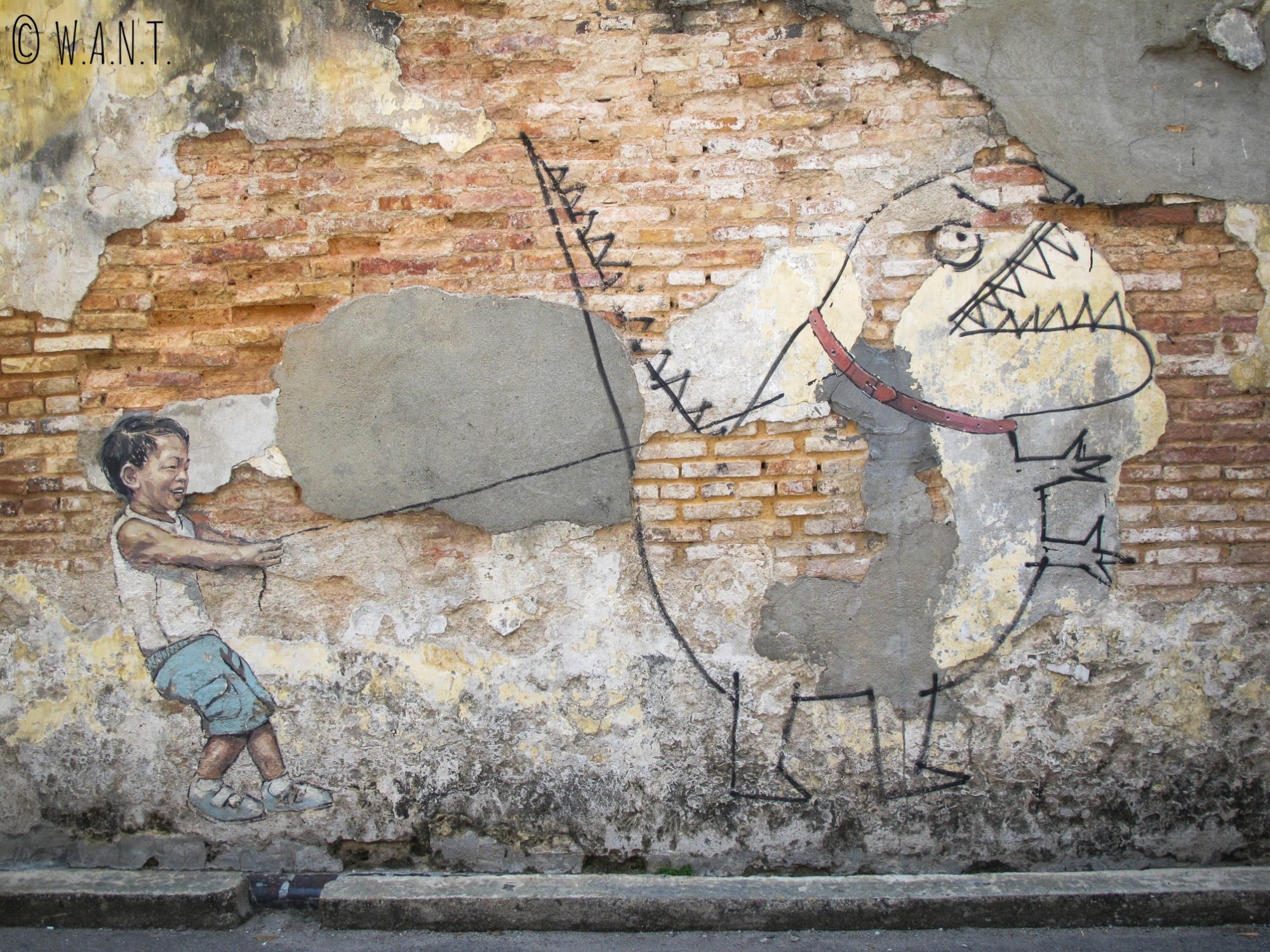 Little boy with pet dinosaur, art de rue dans Georgetown à Penang